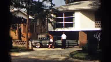 Texas USA (1963): Well-Dressed Suburb Couple Preparing Father Rod Trip On Sunny
