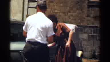 Texas USA (1963): Family Opening And Entering Air Silver Blue Car During Day Time
