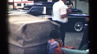 Texas USA (1963): Man Woman And Child Eating In Parking Lot One Irked Cars And