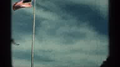 Texas USA (1963): Mesmeric Flag And Brown Building On Bright Sunny Day