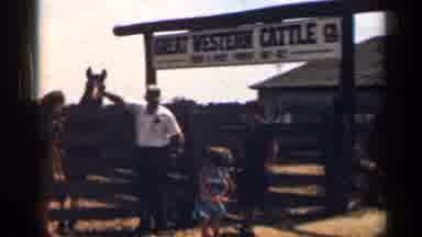 Texas USA (1963): People Standing Next To Fencing Of Cattle And Child Walking Next