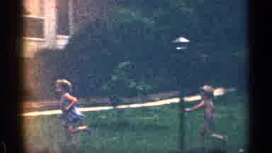 Texas USA (1963): Three Small Children Running And Playing In Backyard On Wm Day