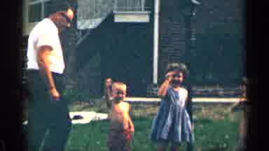 Texas USA (1963): Girl Wearing Blue Dress Eves At Mermen On Cloudy Day