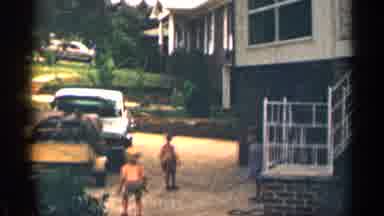 Texas USA (1963): Father With One Daughter And Two Sons Playing Jump Rope In