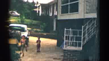 Texas USA (1963): Grandparent Playing Outside With Grinds Jump Rope