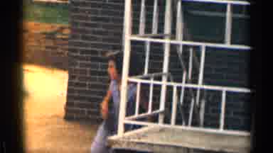 Texas USA (1963): Girl Twirling Jump Rope While Other Kids Watch Father On Side