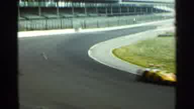Indianapolis USA (1964): Yellow Car Speeding Down Race Car Track Post Comer