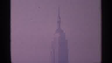 New York City (1964): Large Ship In Ar Bother And A Top Of Tall Skyscraper