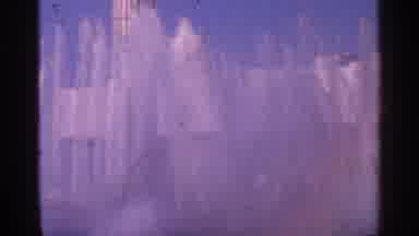 New York City (1964): Big White Building Behind Two Huge Trees Water Splashing Up