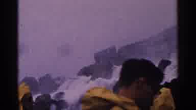 Niagra Falls Canada (1964): Men In Yellow Raincoats Walking Past Beautiful Rock