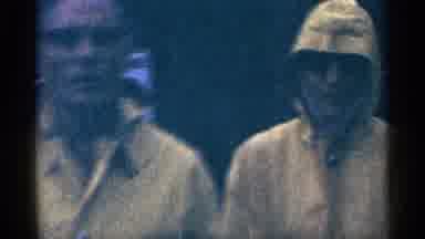 Niagra Falls Canada (1964): Two People Walking In Bright Yellow Raincoats S One