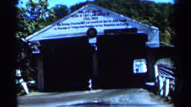 West Virginia (1964): Red Vehicle Drives Out Of Greg Like Tunnel Structure Single
