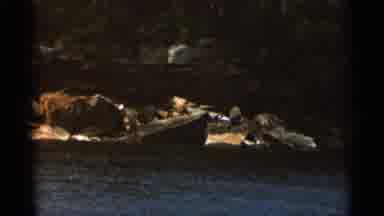 Duluth Minnesota (1965): Forest And Rocky Shore On River A Explosion Happens