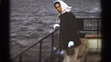 Duluth Minnesota (1965): Modest Woman Looks Over Boys Edge Into Ocean