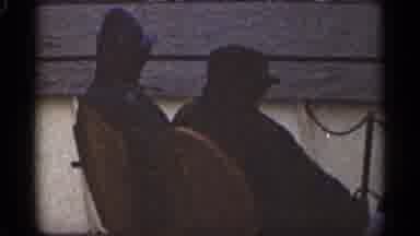 Duluth Minnesota (1965): Two Men In Black Ailing Down River On Airboat
