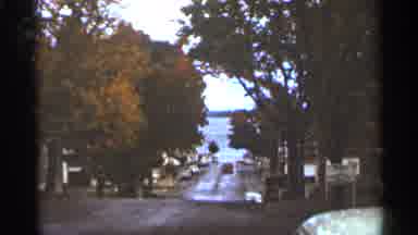 Duluth Minnesota-1965: Man In Baseball Cap Dresses Warmly Father Beach