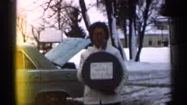 Eau Claire Wisconsin (1966): Woman Standing Outside In Cold And Snow Holding Small