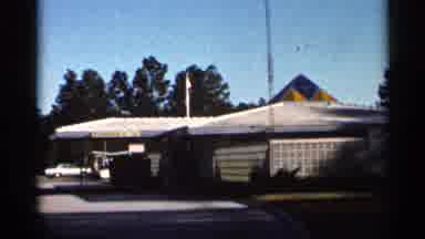 Florida USA (1966): Comer Struggles To Focus On Sign Outside Of Large Brown