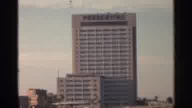 Florida USA (1966): Zing Shots Of Tall Building Next To Bridge That Sits By Blue