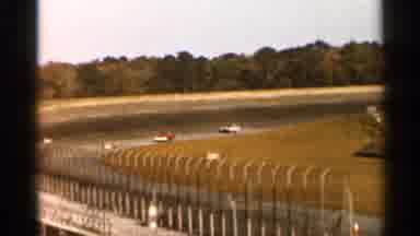 Florida USA (1966): Cars Driving Down Circular Race Truck A Sunset Is Seen
