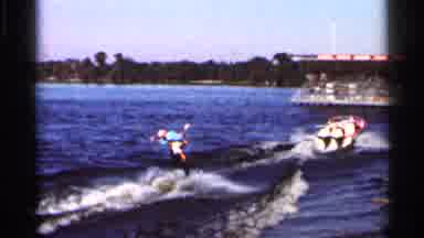 Florida USA (1966): Couple On Single Pr Of Skitters Ski To Earshot Excitedly