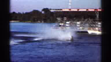 FLORIDA USA-1966: Water Skier Pulled Behind Speedboat at Cypress Gardens