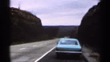 Georgia USA (1966): Blue Car Is Parked On Side Of Two-Len Rod That Passes Between
