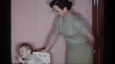New York (1955): Baby Laughing Family Home Eating Table Women Parents Show Clock
