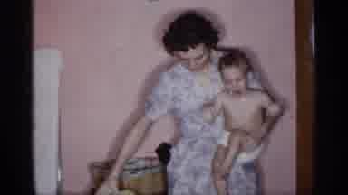 New York (1955): Mir Sitting Down On Chair While She Is Carrying Her Varying
