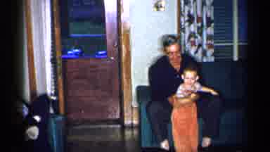 New York (1955): People Sitting In Chris Smiling At Child S He Is Being Pulled