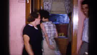 New York (1955): Man Tries To Push Shy Man Out Through Do Other While Woman Lugs