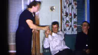New York (1955): Lady W Very Elegy Giving Food To Family Members