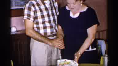 New York (1955): Hippy Smiling Couple Cutting Piece Of Cake Together And Chatting