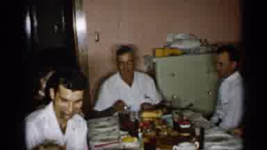 New York (1955): People Sitting Around Dinner Table Talking With Each Other