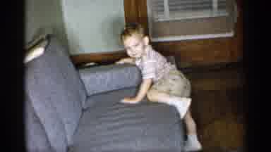 New York (1955): Little Boy Getting Off Father On Bed And Running Round House