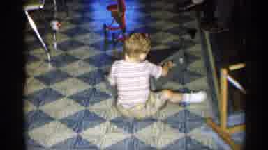 New York (1955): Little Child Is Playing On Flo Other Inside With Silver Box