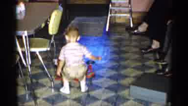 New York (1955): Small Little Boy Playing With Toy Hothouse In Kitchen