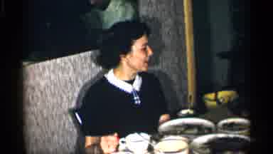 New York (1955): Woman Talking To Companion Over Lunch