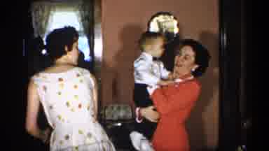 New York (1955): A Adult Woman Holding Small Boy In Her Ems