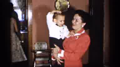 New York (1955): Family Members Enjoys And Leches Small Baby In Fun Cation