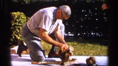 Alabama (1958): Guy With Glasses On Is Turing Coconut In Sunny Day