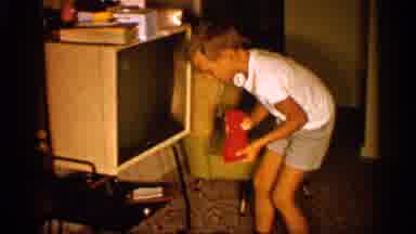 Alabama (1958): Family Room Den Parents Watching Son Play Toy Television