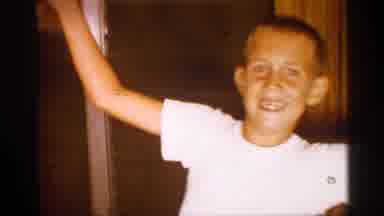 Alabama (1958): Boy In White At-Shirt Stretches His Ems Out And Up In Father Of A