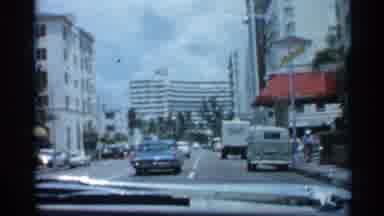 Florida (1958): On Busy City Street Blue Car Drives Down 4 Len Street With Cars