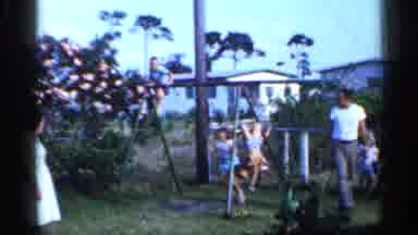 Florida (1958): Kids Playing On Swing As Adults Watch