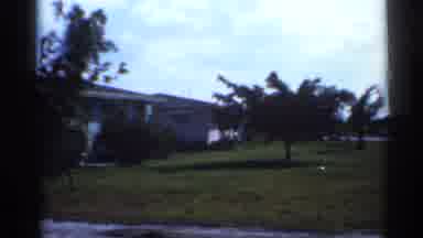 Florida (1958): Two People Walk With Bicycle On Side Of Street On Sunny Day