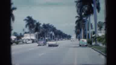 Florida (1958): Man And Two Boys Ply Long Waterline Of Ocean During Day