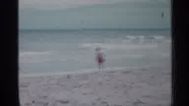 Florida (1958): Little Boy Enjoying Beach Surrounded By His Dad On Nice Day