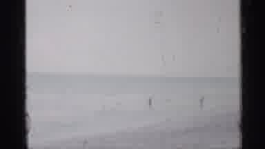 Florida (1958): People Walking On Beach On Bright Sunny Day