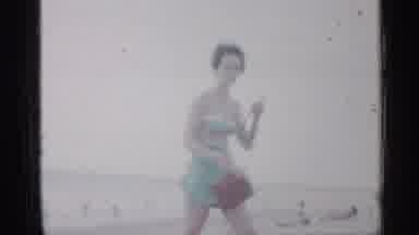 Florida (1958): Lady With Brown B Walking On Beach